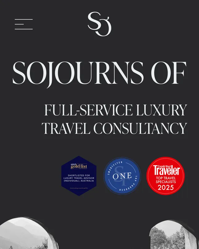 Sojourns Of’s home page on a phone: the SO monogram, ‘Sojourns Of’ and ‘Full-service luxury travel consultancy’ in white on charcoal, above three award badges.